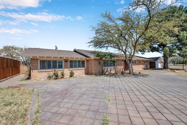 1002 Boyd Ave, Midland, TX 79705 - view of front facade with brick siding and fence