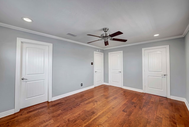 1002 Boyd Ave, Midland, TX 79705 - unfurnished bedroom with wood-type flooring, ornamental molding, baseboards, and visible vents