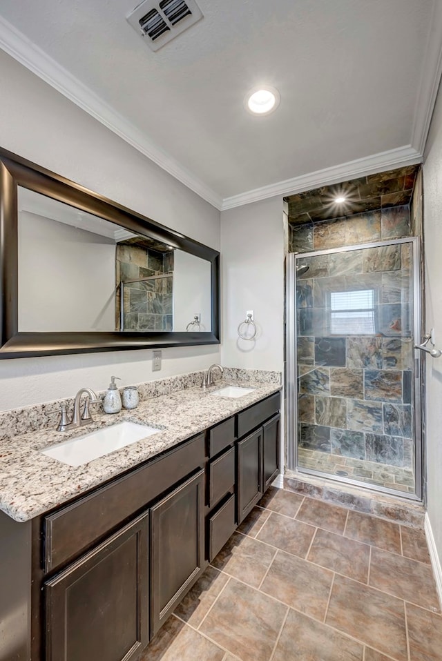 1002 Boyd Ave, Midland, TX 79705 - bathroom featuring a sink, ornamental molding, a stall shower, and visible vents