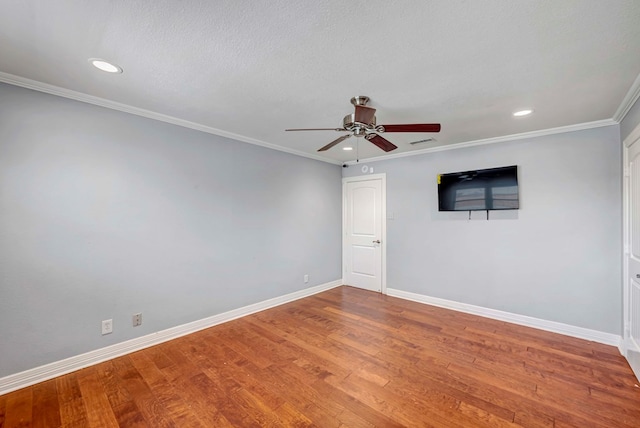 1002 Boyd Ave, Midland, TX 79705 - unfurnished room with baseboards, ornamental molding, wood finished floors, and a ceiling fan