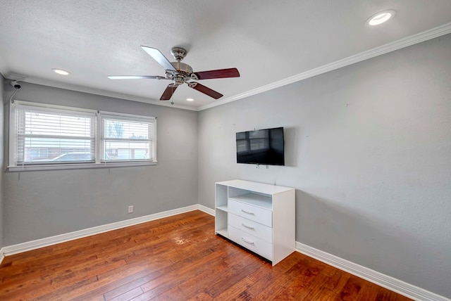 1002 Boyd Ave, Midland, TX 79705 - unfurnished bedroom with ornamental molding, hardwood / wood-style flooring, baseboards, and recessed lighting