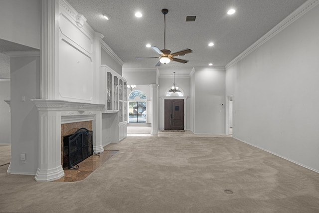 unfurnished living room featuring visible vents, a premium fireplace, ceiling fan, a textured ceiling, and light colored carpet