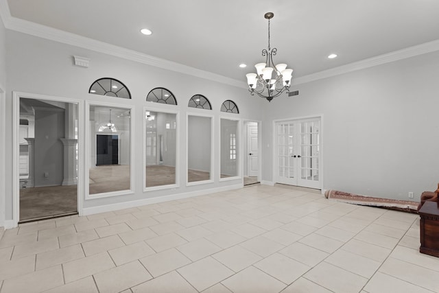 empty room featuring visible vents, light tile patterned flooring, ornamental molding, french doors, and a chandelier