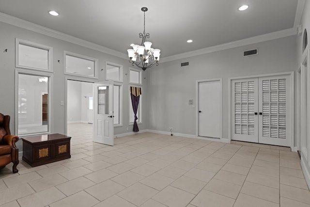 interior space with a notable chandelier, visible vents, and ornamental molding