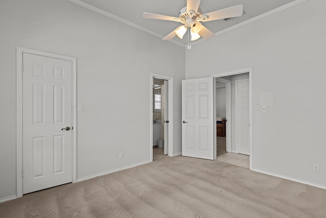 unfurnished bedroom with ceiling fan, baseboards, light colored carpet, and ornamental molding