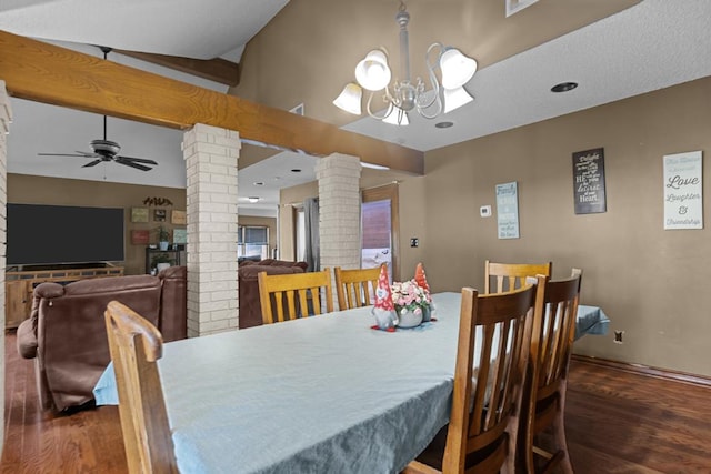 dining room with lofted ceiling, ceiling fan with notable chandelier, decorative columns, and dark hardwood / wood-style floors