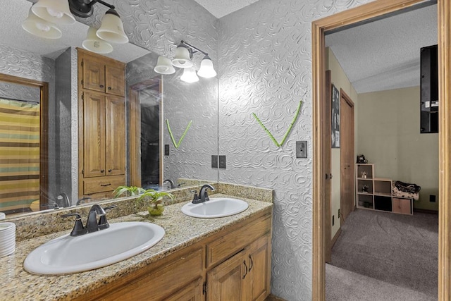 bathroom featuring vanity and a textured ceiling