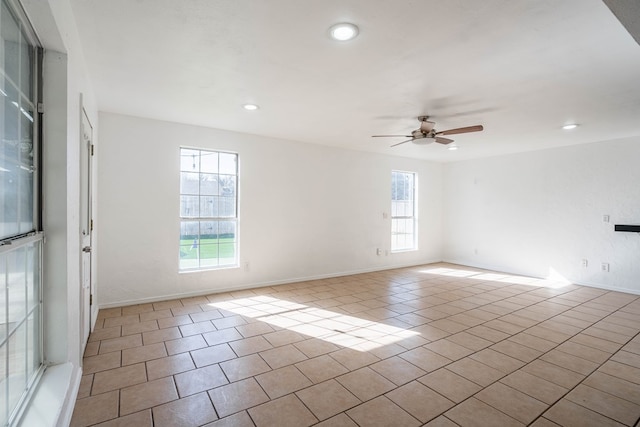 tiled empty room with recessed lighting, baseboards, and ceiling fan