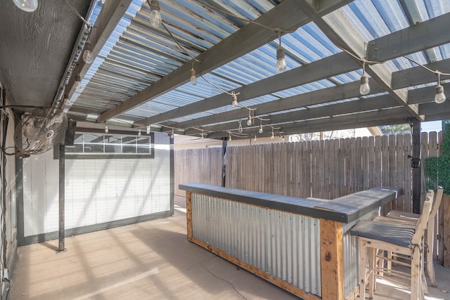 view of patio / terrace with outdoor dry bar, a pergola, and fence