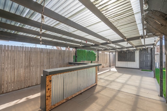 view of patio / terrace featuring fence