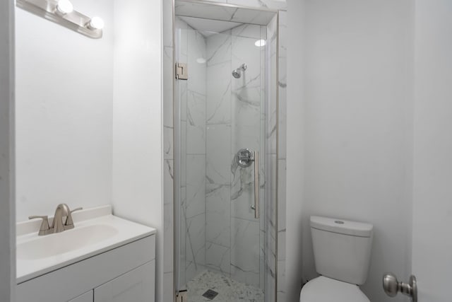 full bathroom with vanity, toilet, and a marble finish shower