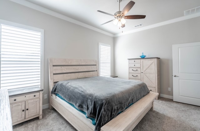 bedroom featuring light carpet, ceiling fan, and ornamental molding