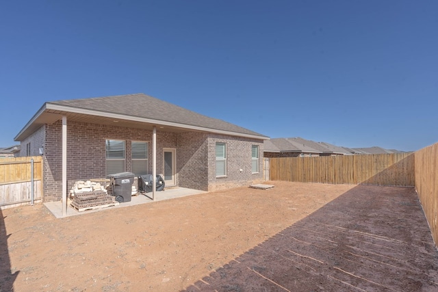 back of house with a patio area