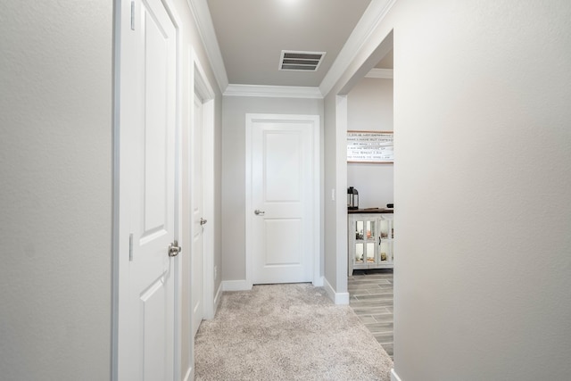 hallway featuring ornamental molding