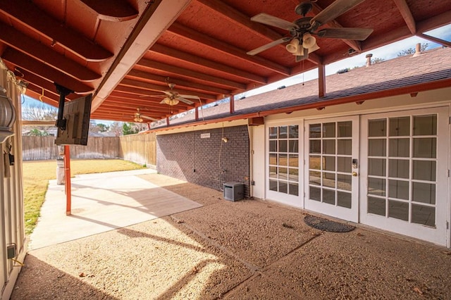 view of patio featuring ceiling fan, french doors, and fence