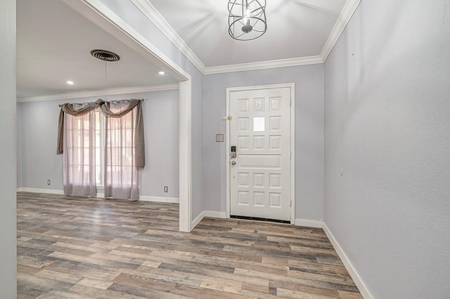 foyer featuring baseboards, recessed lighting, wood finished floors, and crown molding