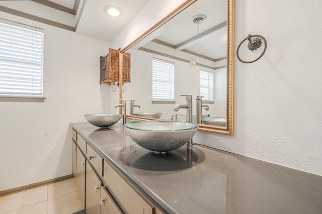 full bathroom featuring a sink, visible vents, and crown molding