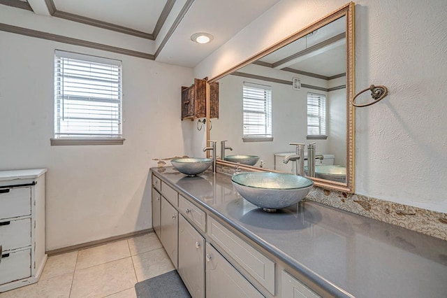 bathroom with ornamental molding, tile patterned flooring, and vanity