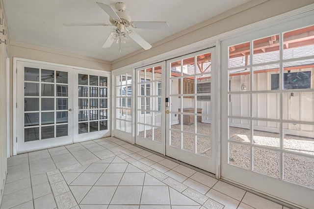 unfurnished sunroom featuring french doors and ceiling fan