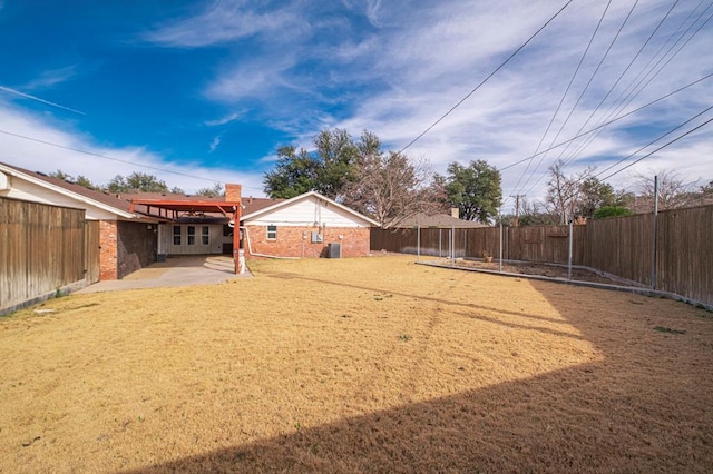 view of yard featuring a fenced backyard and a patio