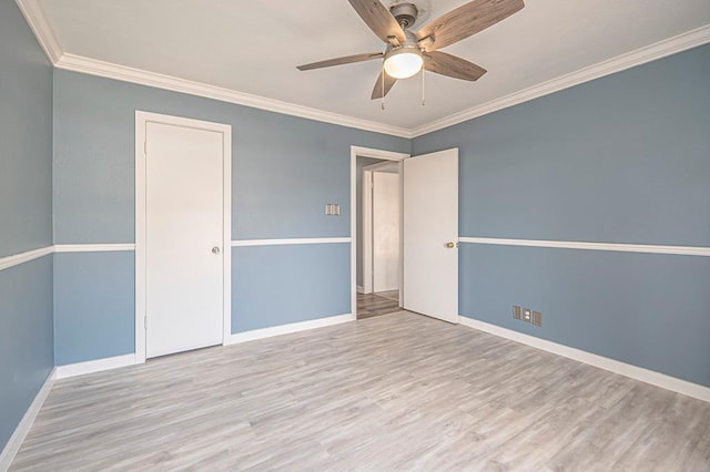 unfurnished room featuring crown molding, ceiling fan, and light hardwood / wood-style flooring