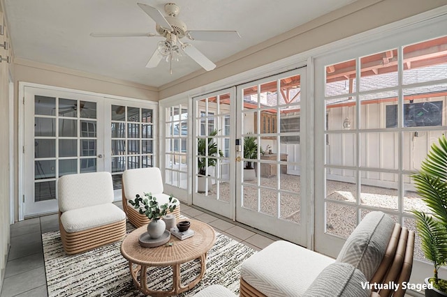 sunroom with ceiling fan and french doors