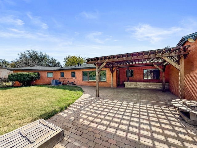 back of property featuring a pergola, a lawn, a patio, and central air condition unit