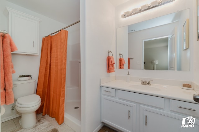 bathroom with toilet, a shower stall, vanity, and tile patterned floors