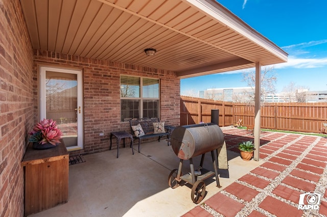 view of patio / terrace featuring fence