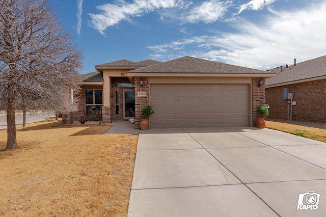 view of front of property with an attached garage, a front lawn, concrete driveway, and brick siding