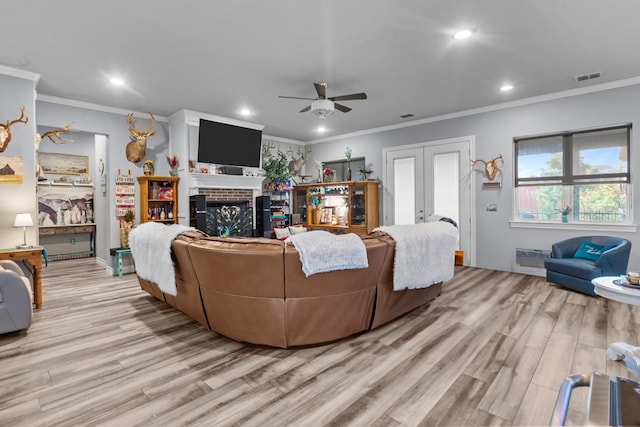 6811 Elkins Rd, Midland, TX 79705 - living area featuring french doors, light wood-style flooring, a ceiling fan, recessed lighting, and ornamental molding