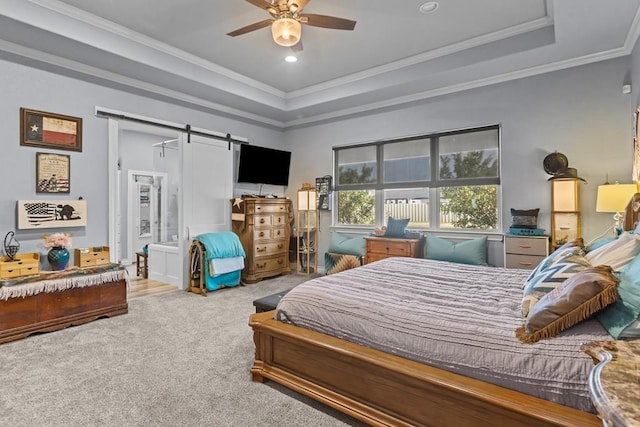6811 Elkins Rd, Midland, TX 79705 - carpeted bedroom with a barn door, a raised ceiling, crown molding, ceiling fan, and ensuite bath