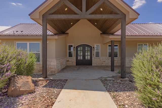 6811 Elkins Rd, Midland, TX 79705 - property entrance featuring french doors, stone siding, and stucco siding