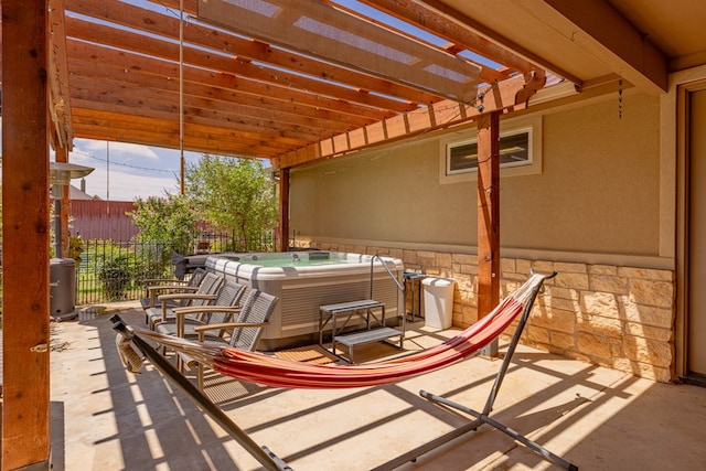 6811 Elkins Rd, Midland, TX 79705 - view of patio featuring a hot tub and a pergola