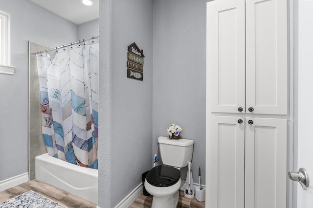 6811 Elkins Rd, Midland, TX 79705 - full bathroom with wood finished floors and shower / tub combo with curtain