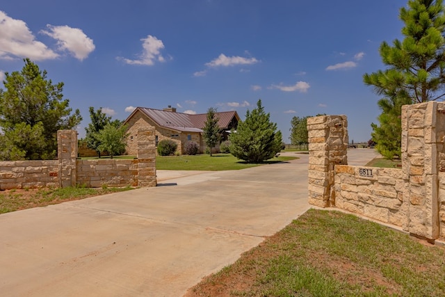 6811 Elkins Rd, Midland, TX 79705 - view of concrete surface featuring a gated entry