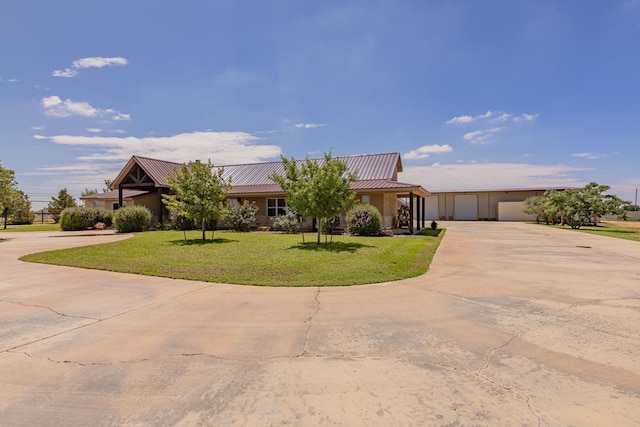 6811 Elkins Rd, Midland, TX 79705 - single story home with concrete driveway, a front lawn, and a metal roof