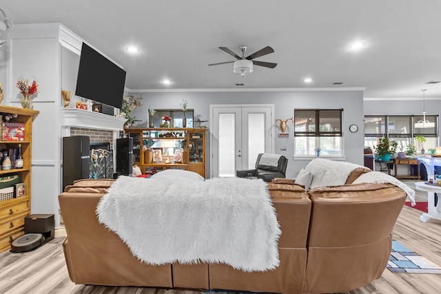 6811 Elkins Rd, Midland, TX 79705 - living area with ceiling fan, wood finished floors, crown molding, french doors, and a fireplace