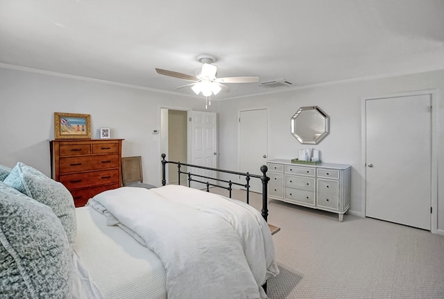 bedroom featuring crown molding, light carpet, and ceiling fan