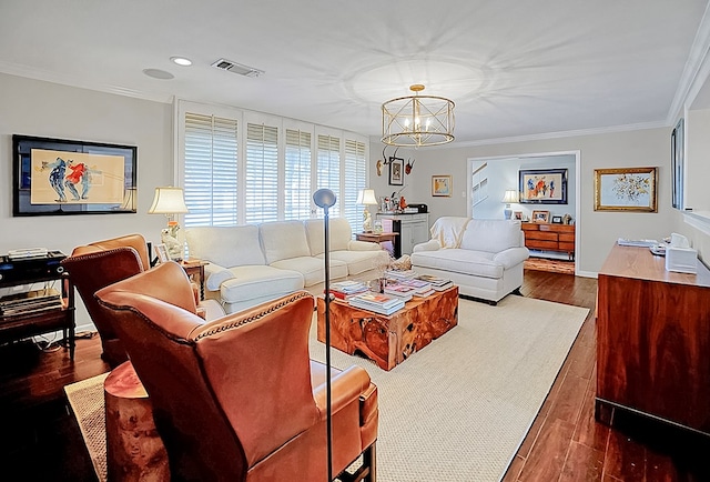 living room with crown molding, a notable chandelier, and dark hardwood / wood-style flooring