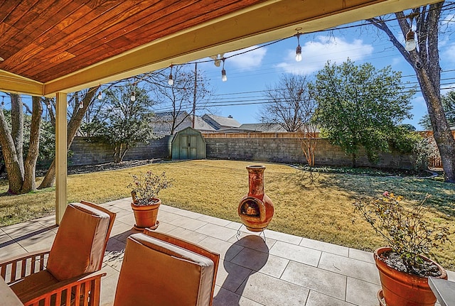 view of patio with a storage unit