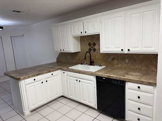 kitchen with tile countertops, visible vents, a peninsula, a sink, and dishwasher