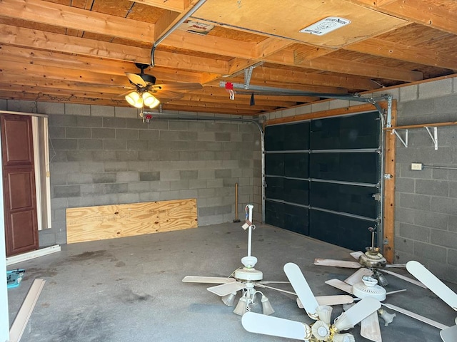 garage with concrete block wall