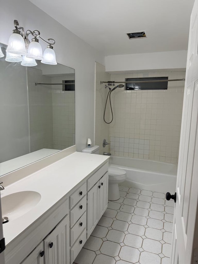 full bath featuring vanity, toilet, and tub / shower combination