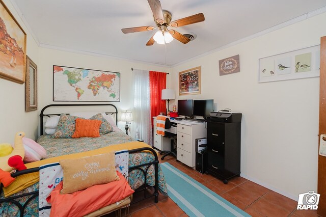 tiled bedroom with ornamental molding, a ceiling fan, and baseboards