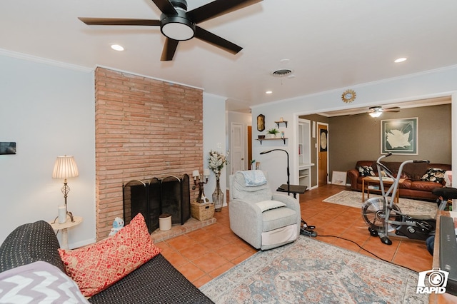 tiled living room featuring crown molding, visible vents, a fireplace, and ceiling fan