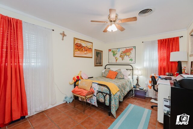 tiled bedroom with ceiling fan, visible vents, and ornamental molding