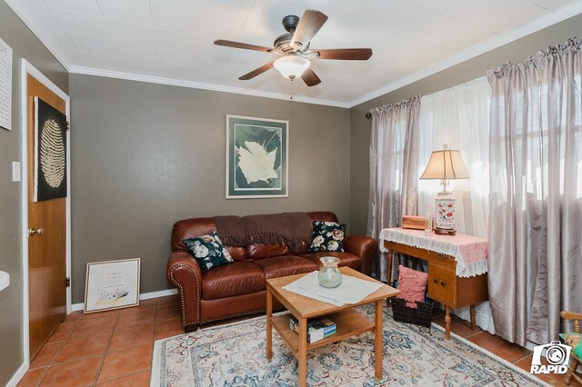 living room with ceiling fan, crown molding, baseboards, and tile patterned floors