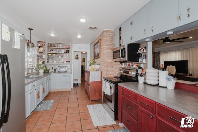 kitchen featuring visible vents, appliances with stainless steel finishes, open shelves, a sink, and light tile patterned flooring