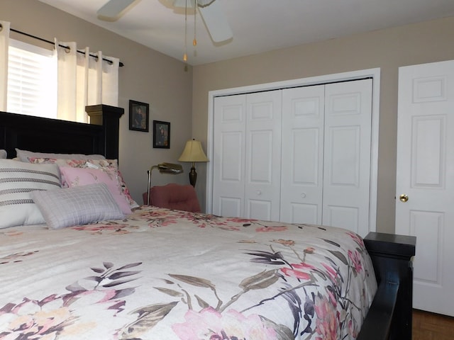 bedroom featuring ceiling fan and a closet